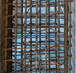 Reinforcement rebar steel rods of a column ready for concrete pouring at a construction site