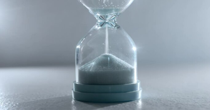 Close-up of sand hourglasses captures time's fleeting nature Sand hourglasses remind importance of time planning ancient timekeeping methods. Sand hourglasses signifies change urging new beginnings.