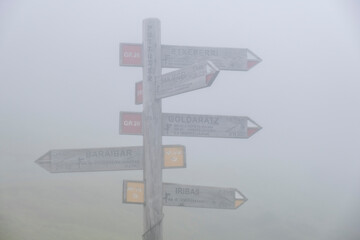 guidance sign in the middle of the fog, Sierra de Aralar, Navarra, spain