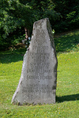 Standing Stone beside Llandaff Cathedral marking the spot where a German landmine fell on 2nd January 1941 causing severe damage to the cathedral.
