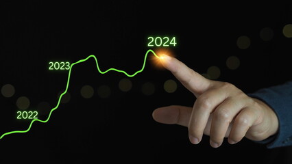 Businessman drawing virtual technical graph and chart for analyzing stock market, business growth, marketing strategy concept