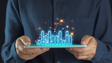 Businessman drawing virtual technical graph and chart for analysis stock market, technology...