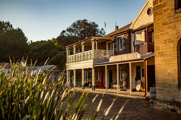 The view of the featured village houses and pub in the Flagstaff Hill Maritime Village in Warrnambool in the sunset