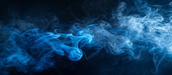 An artistic closeup of electric blue smoke resembling a geological phenomenon on a black background, creating a mesmerizing pattern in space - obrazy, fototapety, plakaty