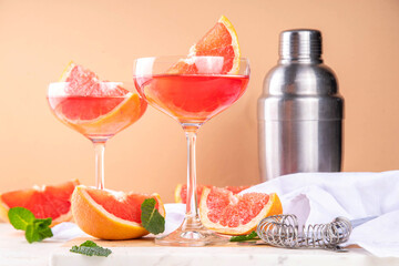 Grapefruit martini cocktail with cold champagne