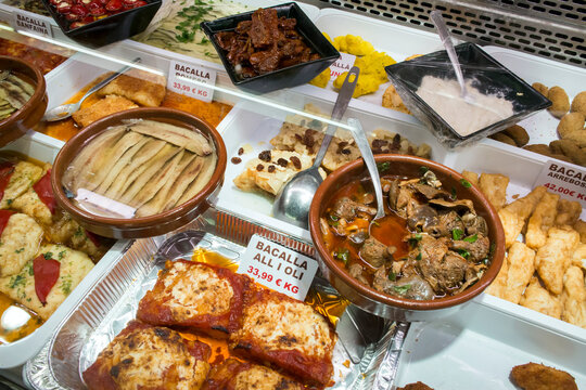 Ready meals in a stall of the old Abaceria Central Market in the Gracia neighborhood, Barcelona