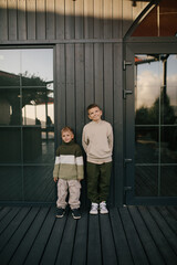 Two boys brothers having fun spending time together outdoors.