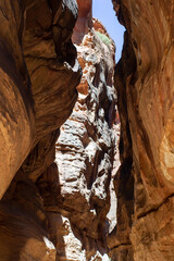 Jordan. Petra. Siq Canyon. Road to rock-cut city of Petra through the Siq mountain canyon. Sheer...