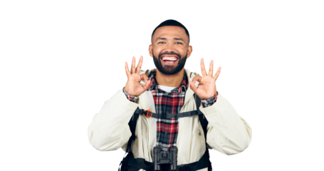 Okay sign, hiking and portrait of man with smile, backpack isolated on transparent png background. Travel, adventure and excited person with vote, review or perfect hand gesture on camping holiday.