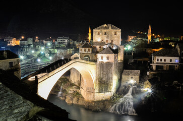 Night view of the Old Bridge in Mostar city in Bosnia and Herzegovina. Neretva river. Unesco World...