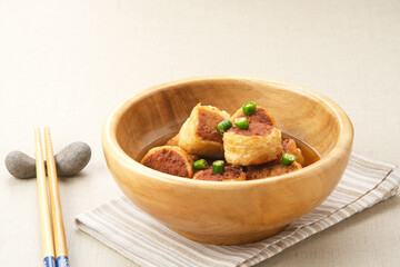 Gohyong or Ngo Hiang, made from minced chicken with flour, served with sour sauce
