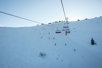 Fototapeta na wymiar Cable car for skiers. Winter sports in the mountains. Sports and recreation concept.