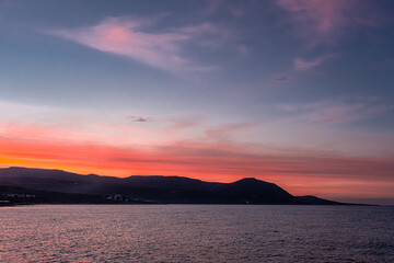 View of the Sunset at Chrysochou Bay as seen from Latsi village harbor, located by the sea, near...