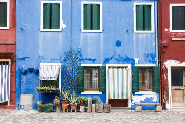 Murano and Burano island landscape. Venice region in Italy. Colorful carious home facades.