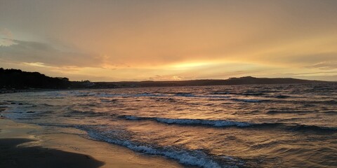 Fototapeta na wymiar SUNSET AT THE BEACH