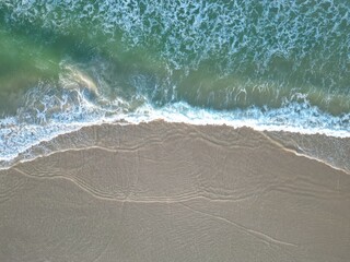 Waves Crashing on the Sandy Beach