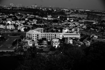 black and white  Full frame shot of building, View of cityscape against sky during sunset,Vehicles on road in city against sky. Buildings in city against cloudy sky