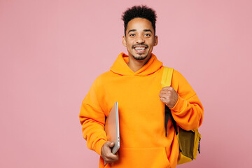 Young smart student IT man of African American ethnicity yellow hoody casual clothes backpack bag...