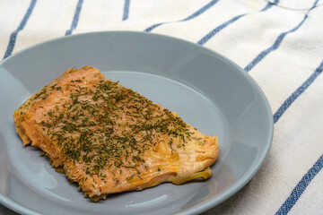 Piece of oven baked salmon on a plate