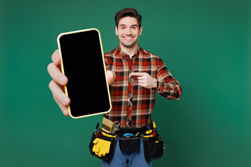 Young employee laborer man wears red shirt use point on blank screen workspace area mobile cell...