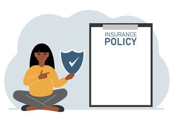 A woman holds an insurance policy sign in his hands. The concept of life insurance, property or natural disasters.