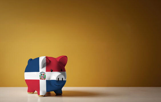 Piggy bank with painting of Dominican Republic flag. The problem is in the economy. Economic crisis. Saving money concept.