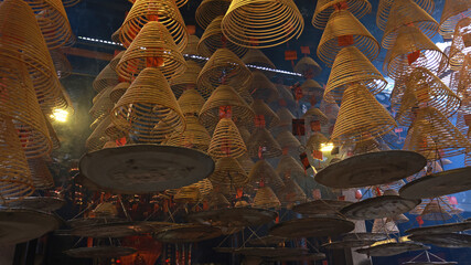 large amount of incense coils at the top of hong kong Chinese taoist temple  - 736964506