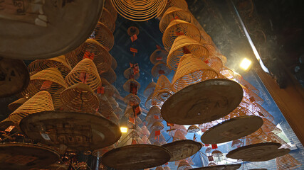 large amount of incense coils at the top of hong kong Chinese taoist temple  - 736964547
