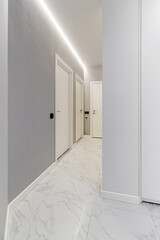 white corridor without people with metal gray doors