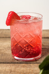 strawberry cocktail in a glass with white background