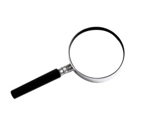 A black and silver magnifying glass lies on a white background.