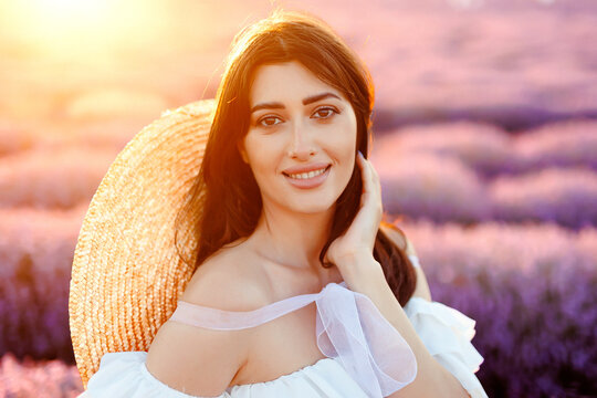 Portrait of a girl in lavender field holding violet lavender flowers