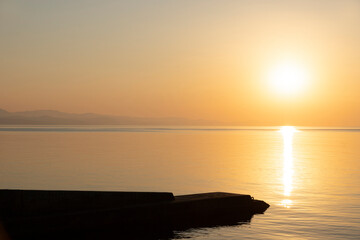 Obraz premium A beautiful, colorful sunrise with a sunny path over the sea.