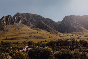 Aerial drone view of Amazing Piatra Secuiului mountain and Rimetea village in Transylvania, Romania...