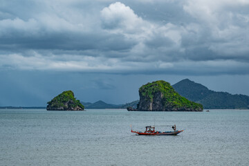 boat in the sea with the islands view 