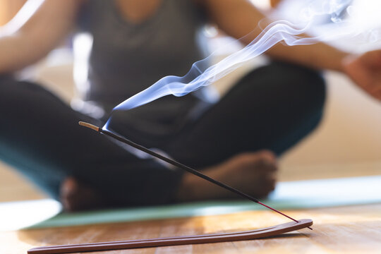 Close-up of incense stick burning during a meditation session at home