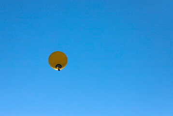 Colorful hot air balloon flying on sky.