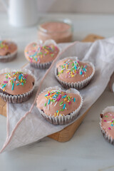Chocolate cupcakes decorated with fresh cream raspberries 