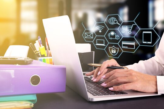 Women hand using laptop sell online to people shopping online with chat box, shopping carts, pop up dollar icons. Social networking concept.