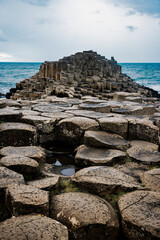 A dramatic landscape photo featuring the Giant's Causeway, a UNESCO World Heritage Site in Northern Ireland.