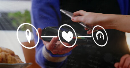 Image of digital interface with icons and data processing over person paying with smartphone