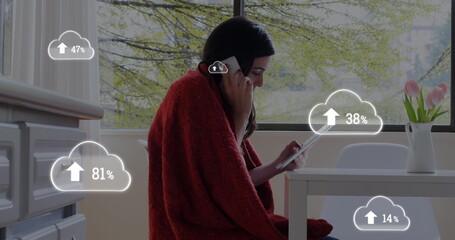 Image of digital interface with cloud icons and numbers growing over woman talking on smartphone hol