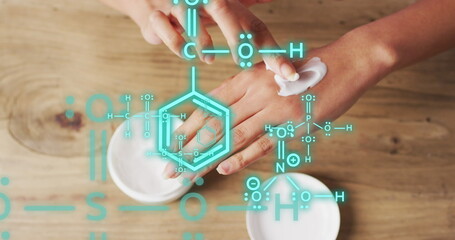 Image of chemical structures over biracial woman putting cream on her hand - Powered by Adobe