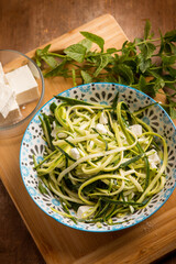 raw zucchinis salad with feta cheese - 737012392