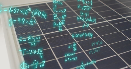 Image of mathematical equations over solar panels