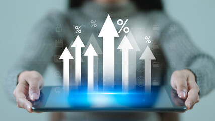 Interest rate and dividend, Businessman hold up arrow icon and percentage with graph indicators for investment growth. business financial investment, business growth, income, marketing and profit.