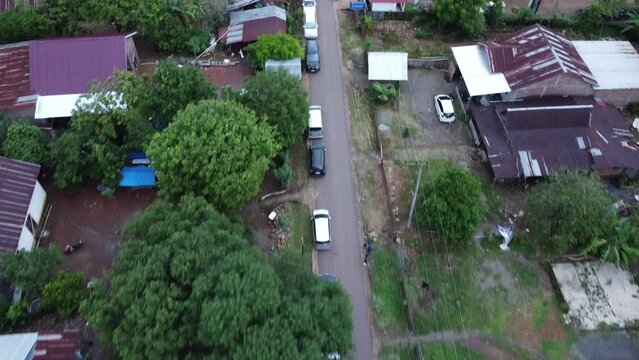You can see several cars parked neatly next to residents' houses