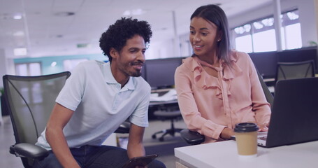 Biracial couple collaborates in a modern office setting