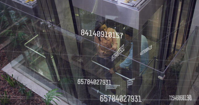 Image of data processing over diverse business people in elevator - Powered by Adobe