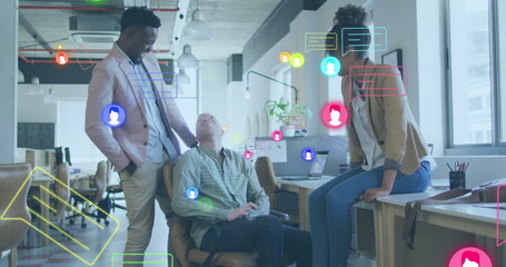 Image of media icons over diverse business people in office